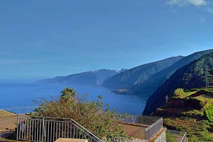 a bench on the side of a mountain